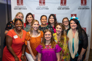 Junior League members posing after a community event